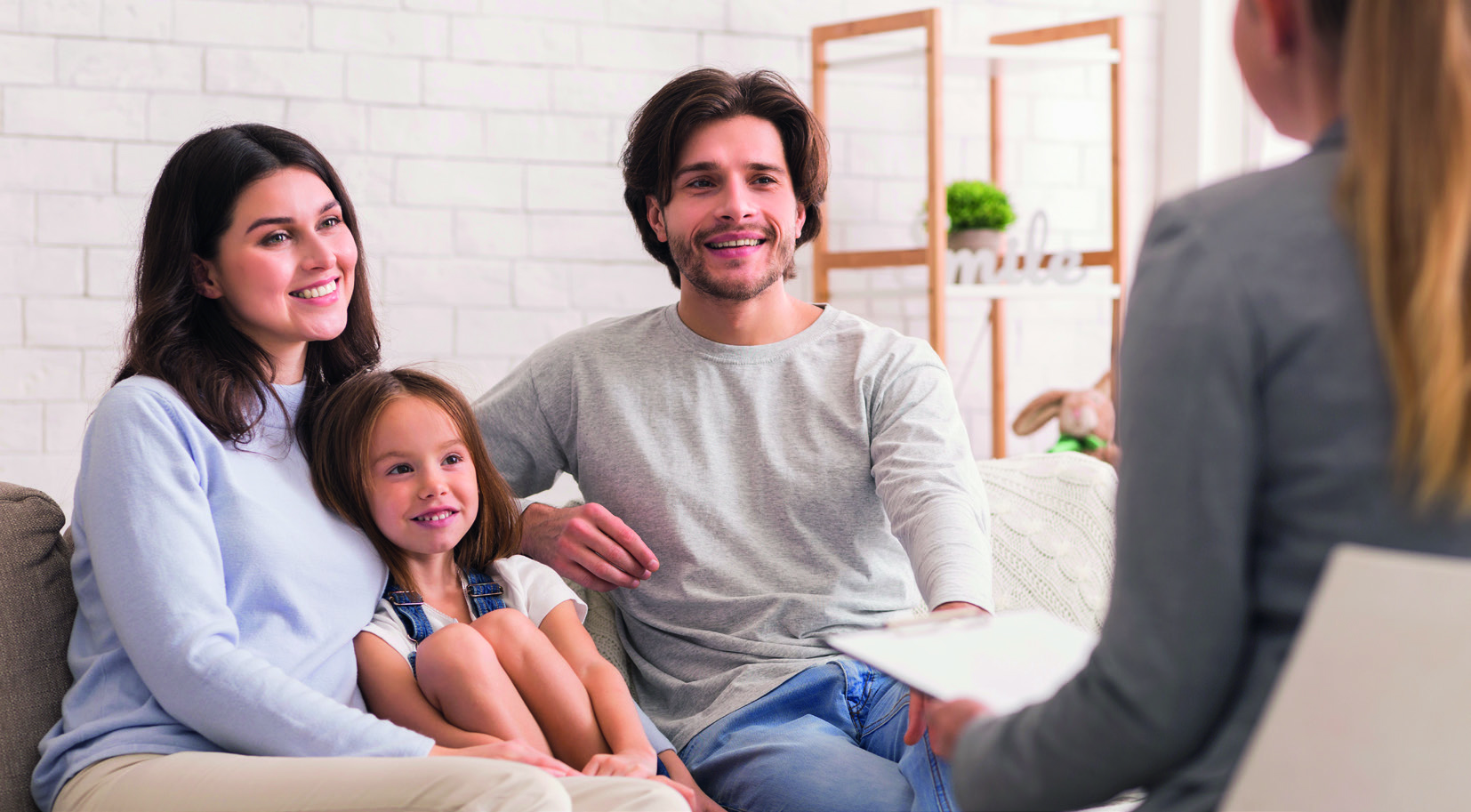 Parents With Little Daughter Sitting At Psycholigist’s Office Af